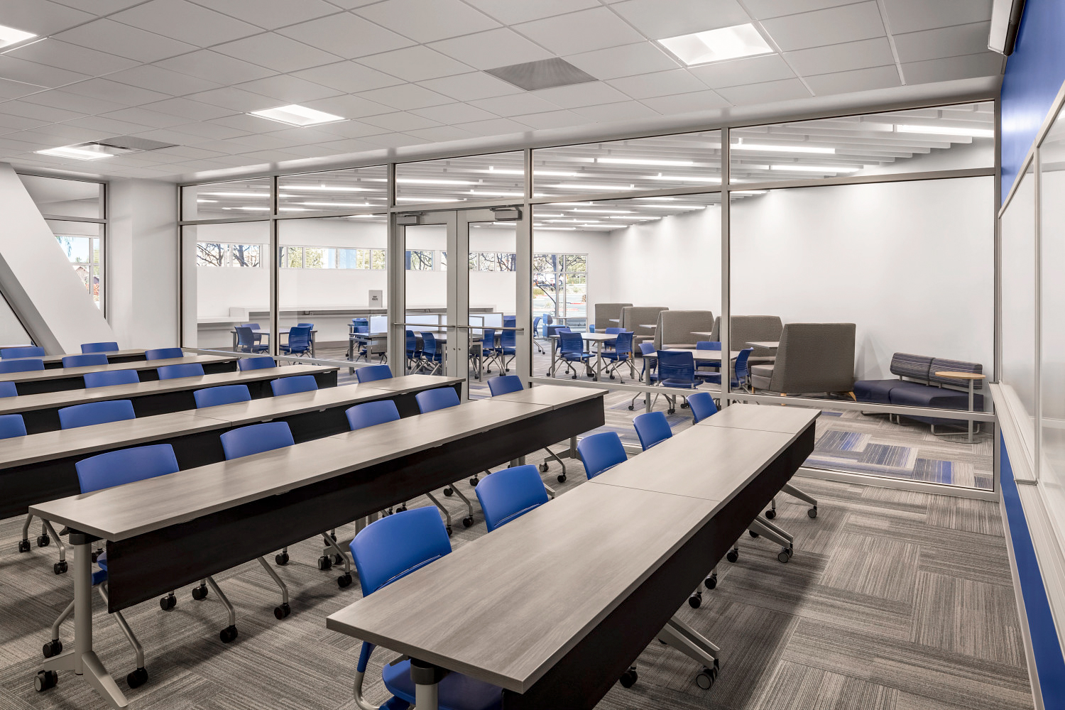 The classroom is designed with versatile and convenient desks and chairs